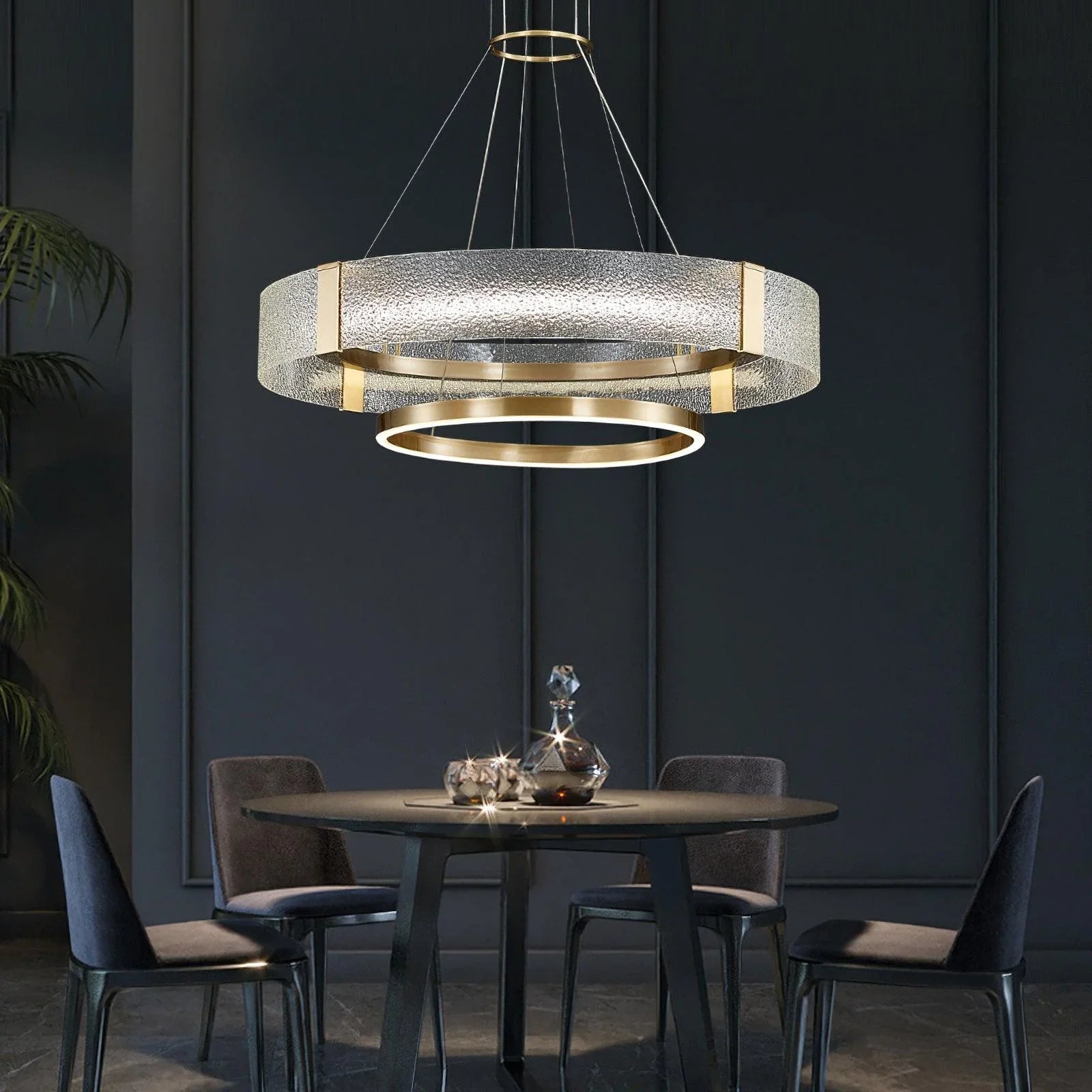 Modern gold and glass pendant chandelier above round dining table, YH Lamps designer lighting