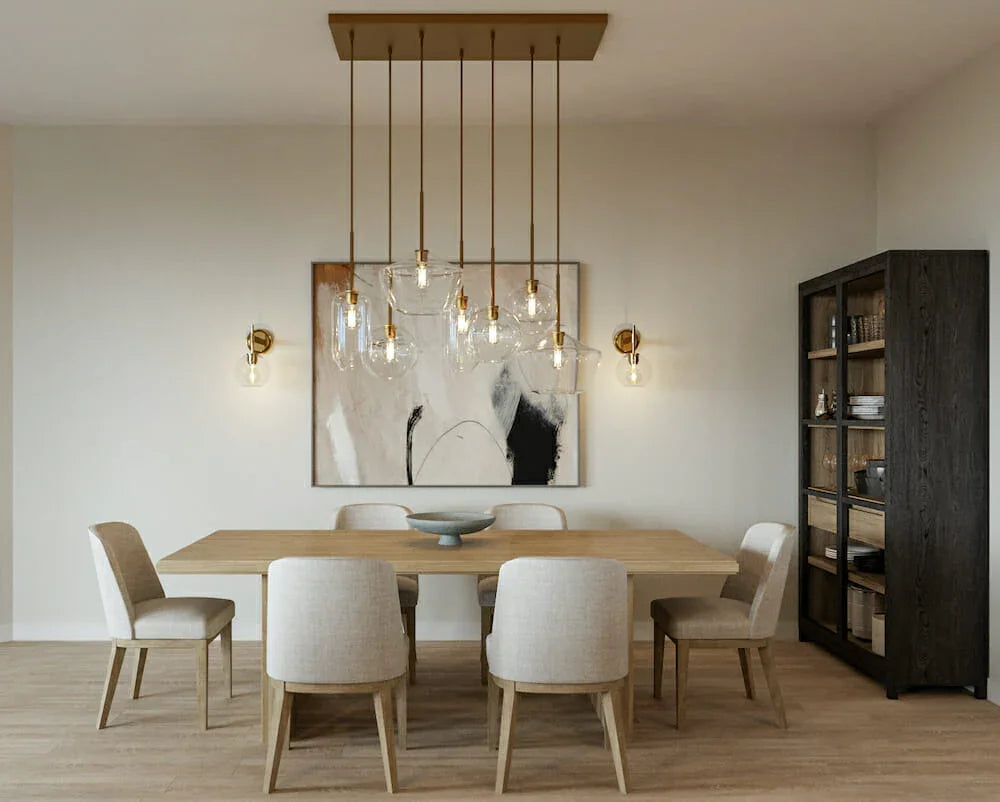 Modern dining room with YH Lamps brass wall sconces, chandelier, and neutral decor