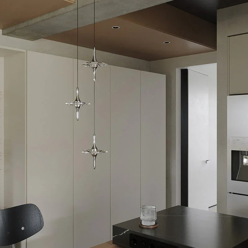 Modern glass pendant lights in a minimalist kitchen, premium designer lighting by YH Lamps.