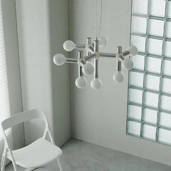 Modern designer chandelier with exposed bulbs in minimalist room, YH Lamps premium lighting