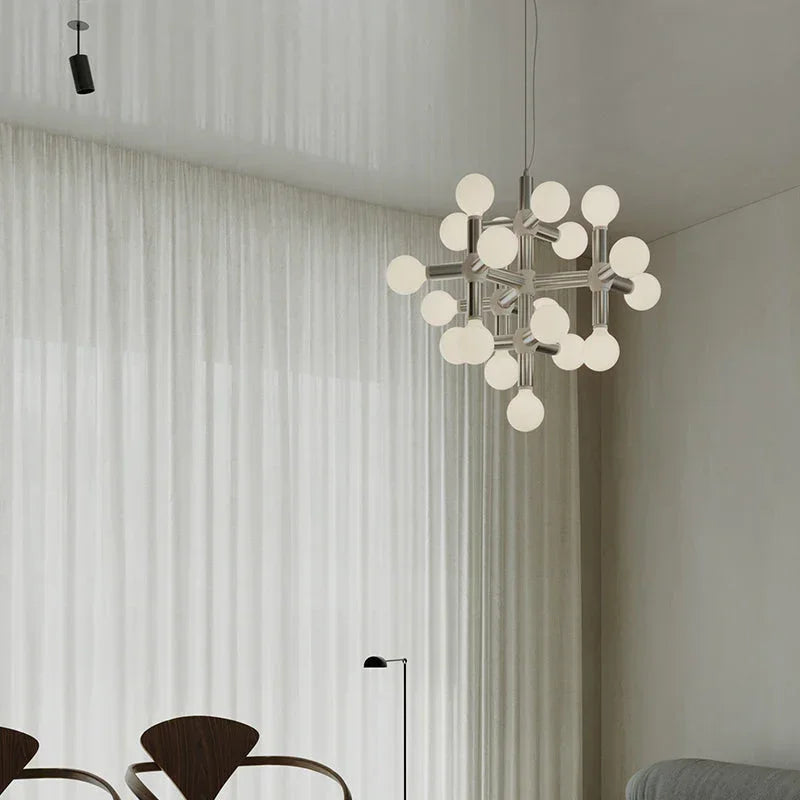 Modern geometric chandelier with frosted globes in minimalist living room by YH Lamps