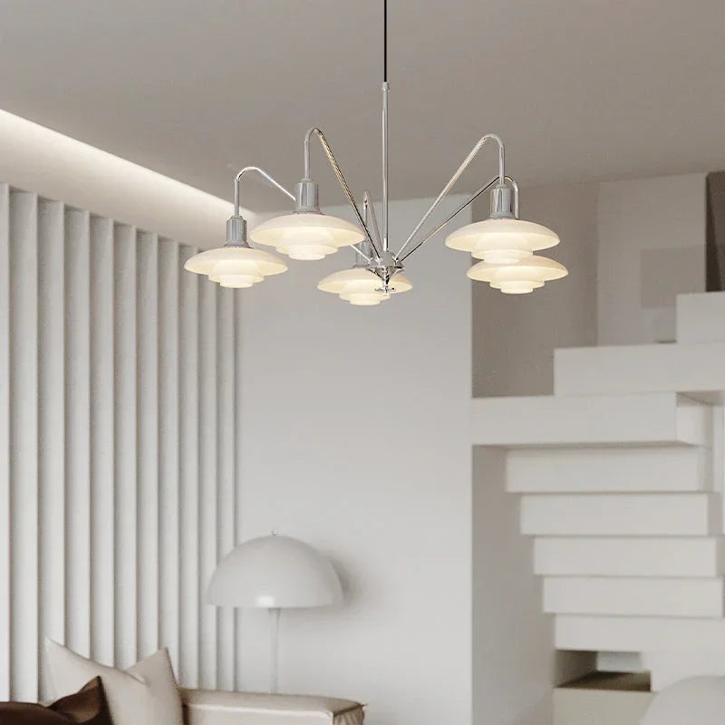 Modern chandelier with layered glass shades by YH Lamps in a minimalist living room setting