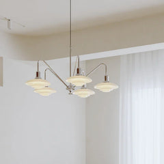 Modern designer chandelier with layered glass shades in a minimalist living space, YH Lamps