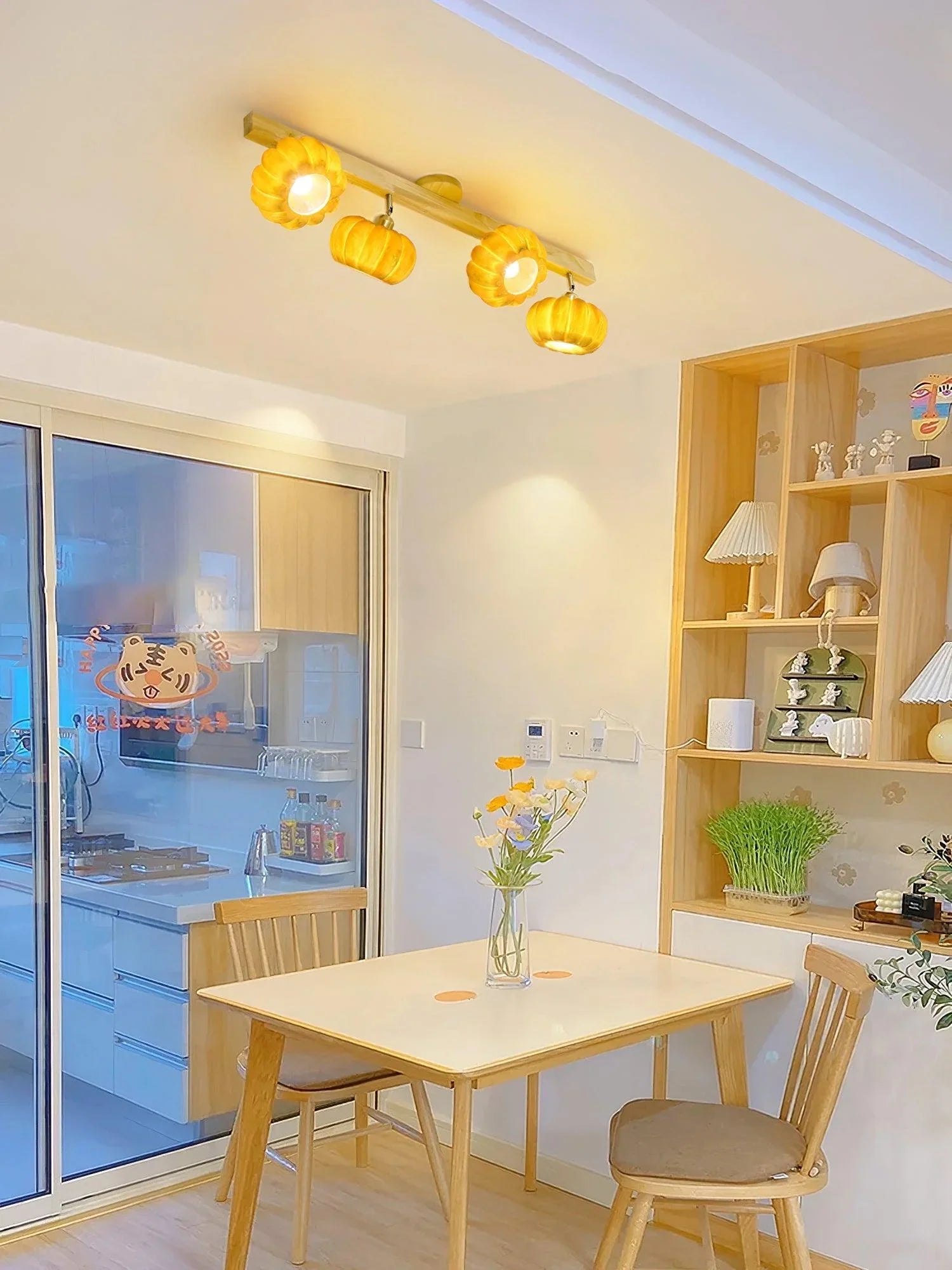 Modern pumpkin-shaped yellow ceiling lamp with wood accent in a bright dining area at YH Lamps