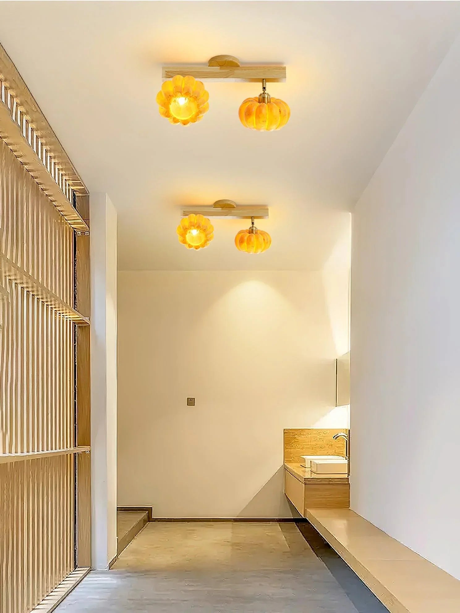 Modern pumpkin-shaped yellow wood ceiling lamps lighting a minimalist hallway from YH Lamps