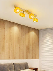 Modern pumpkin-shaped yellow ceiling lamp with wood finish in cozy bedroom, YH Lamps lighting