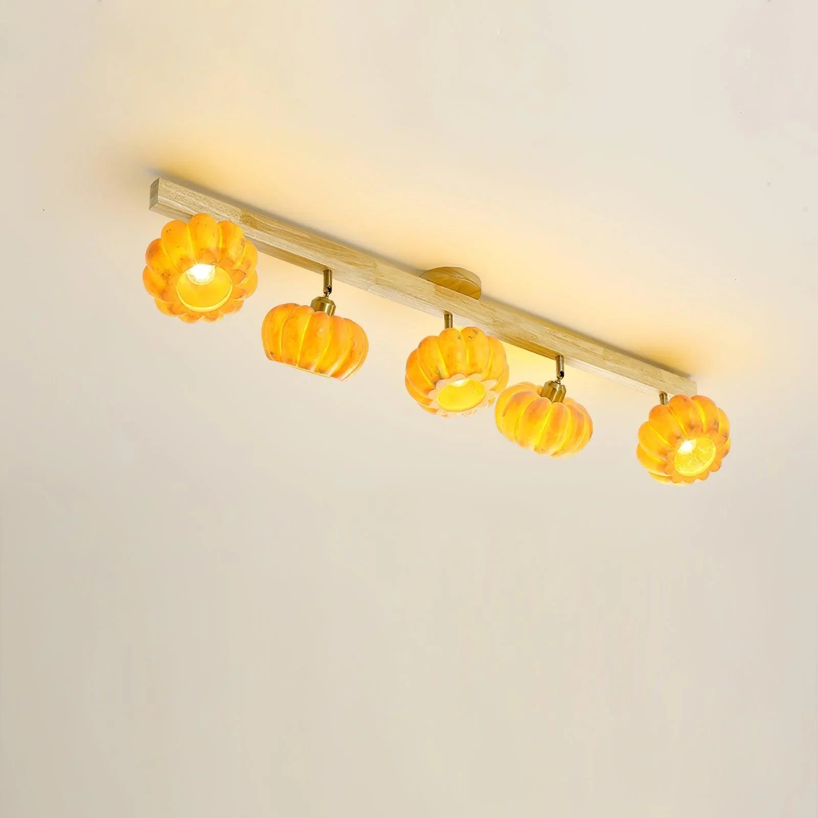 Modern ceiling lamp with five yellow pumpkin-shaped lights on a wooden base, YH Lamps