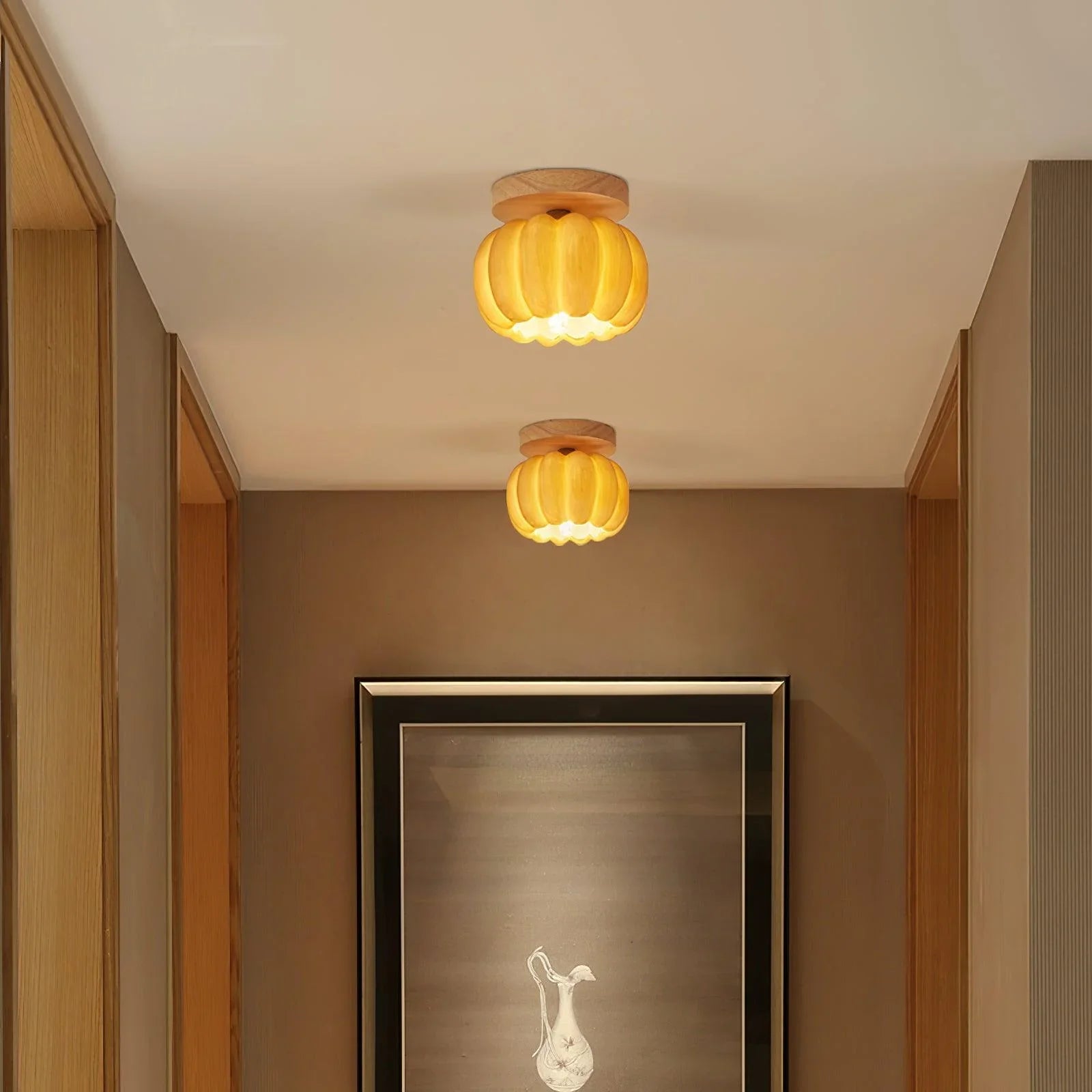 Modern hallway with two YH Lamps pumpkin ceiling lights in yellow wood tone, warm ambient glow