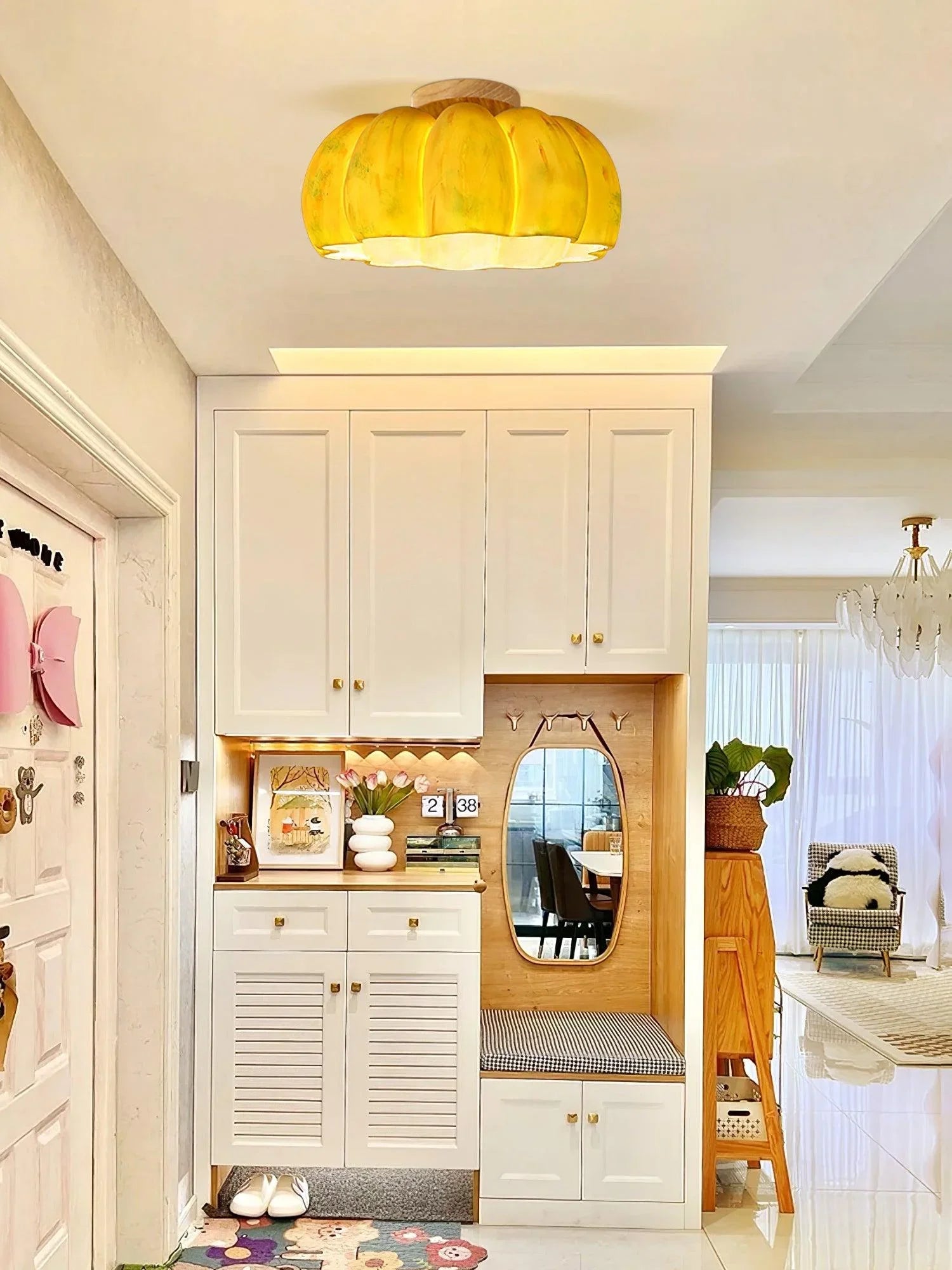 Yellow pumpkin-shaped ceiling lamp in modern entryway with white built-ins, from YH Lamps