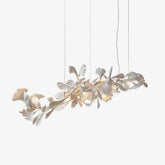 Modern gold and white Gingko leaf chandelier pendant light with delicate leaf design and warm LED bulbs