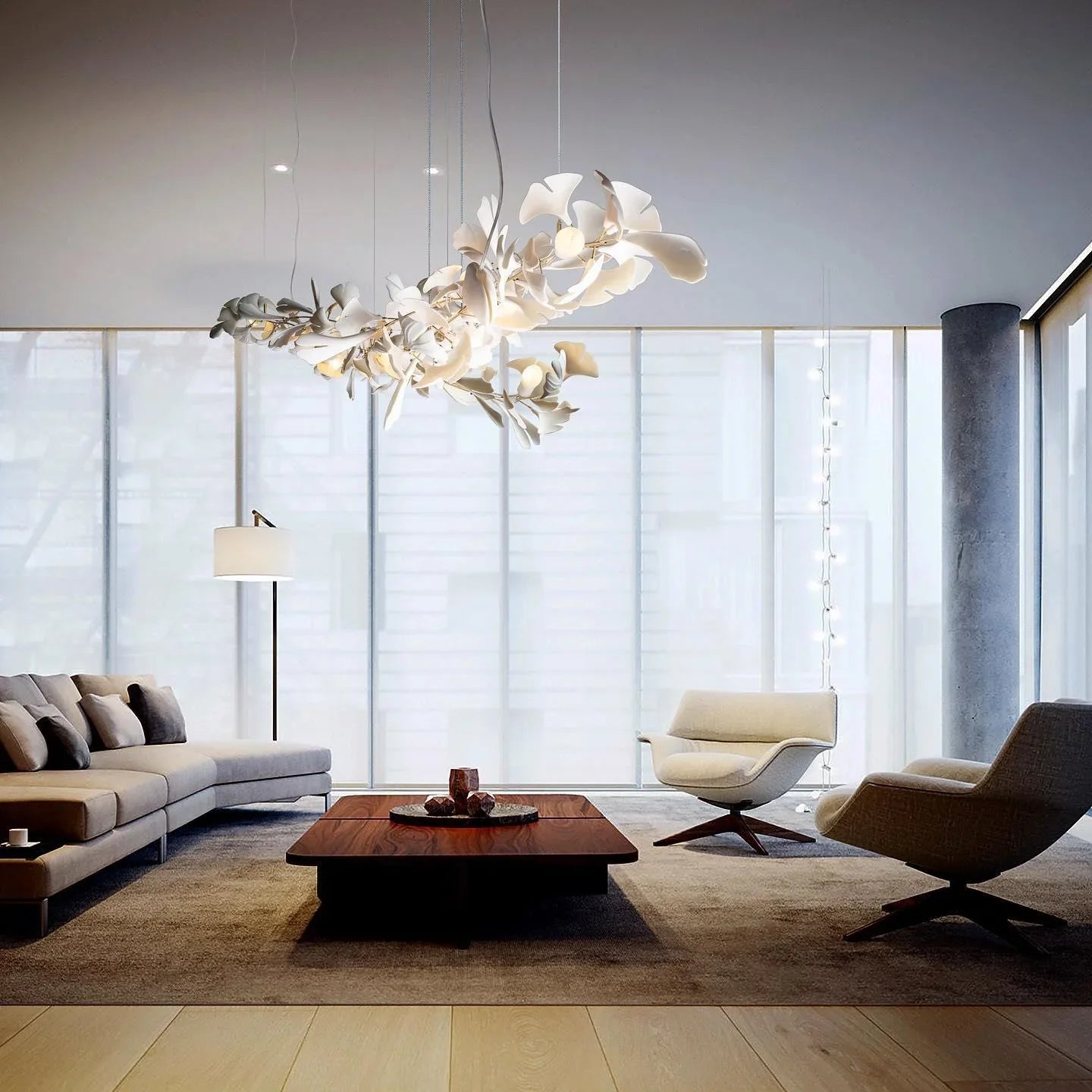 Modern living room with beige sofa, two armchairs, wooden coffee table, and white gold gingko chandelier