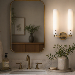 Deborah Double Sconce featuring two cylindrical frosted glass shades on a vintage-inspired brushed brass mount, perfect for luxury bathroom vanity lighting - YH Lamps