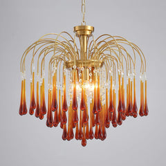 Modern brass chandelier with amber glass teardrop pendants and clear crystal accents