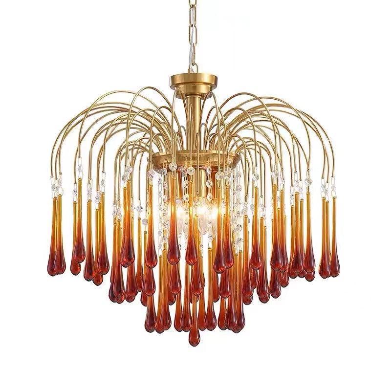 Modern brass chandelier pendant lamp with elongated amber glass drops and crystal accents from YhLamps
