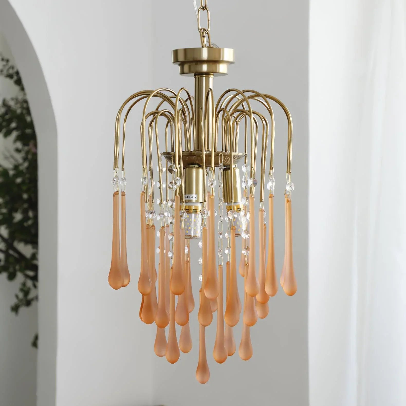 Modern brass chandelier pendant lamp with elegant amber glass droplets and crystal accents