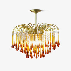 Modern brass chandelier with amber glass teardrops and clear crystal accents from YhLamps