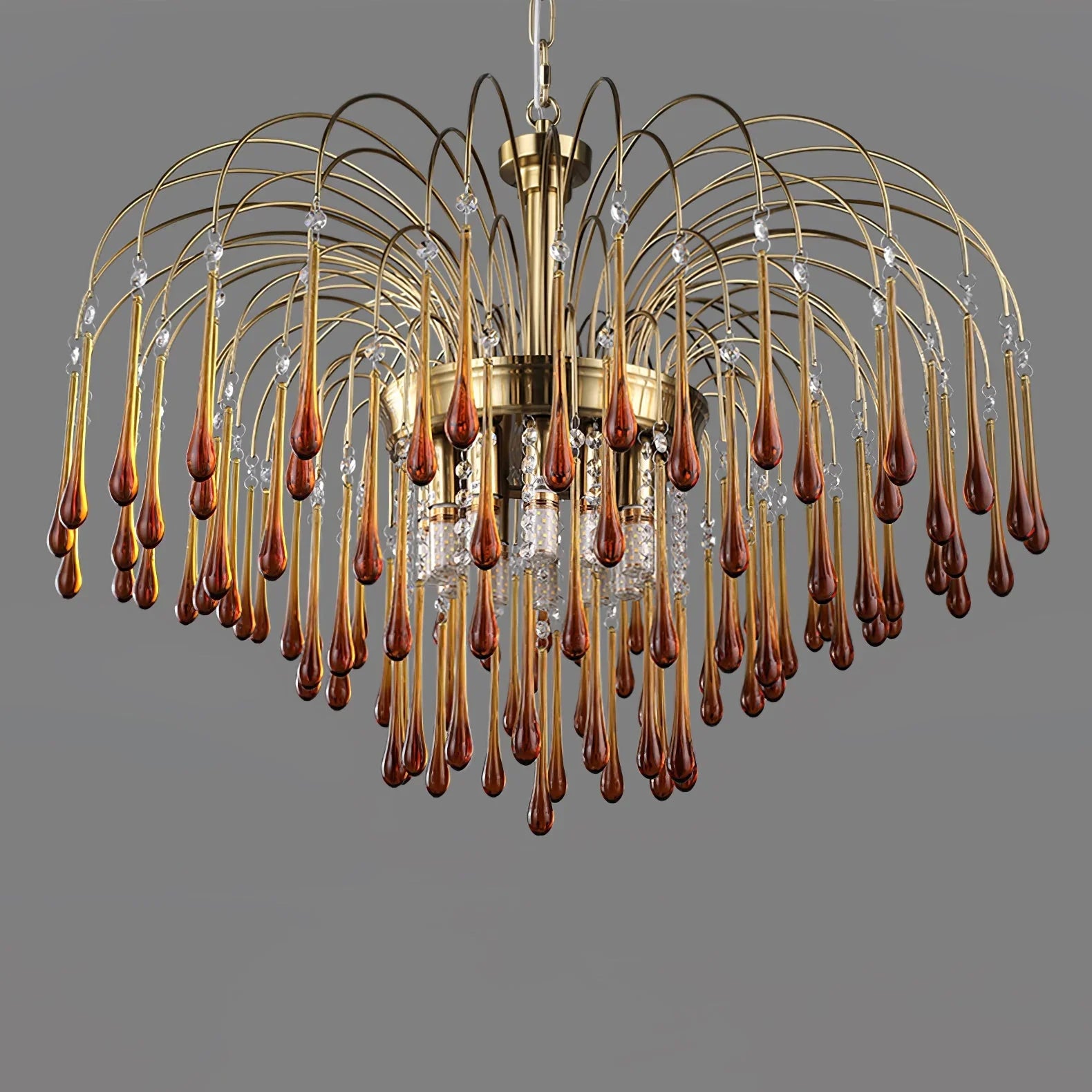 Modern brass chandelier with clear maltose glass drops hanging in multiple curved arcs