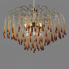 Modern brass chandelier with clear maltose glass drops hanging in multiple curved arcs