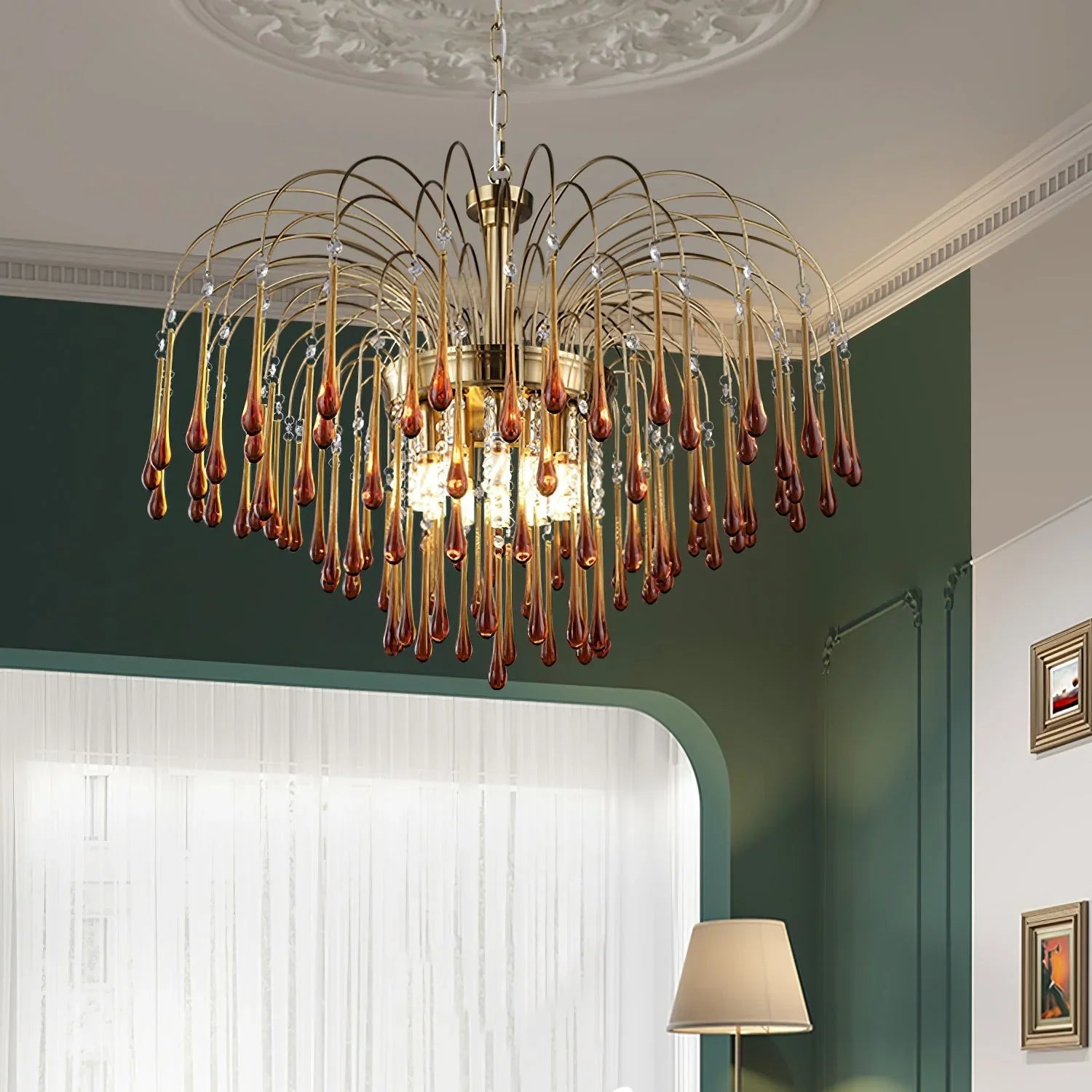Modern brass chandelier pendant lamp with amber glass drops hanging in elegant living room