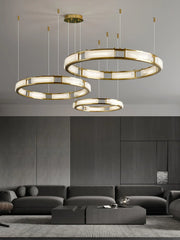 Modern living room featuring YH Lamps brass and alabaster pendant chandelier with three warm light rings
