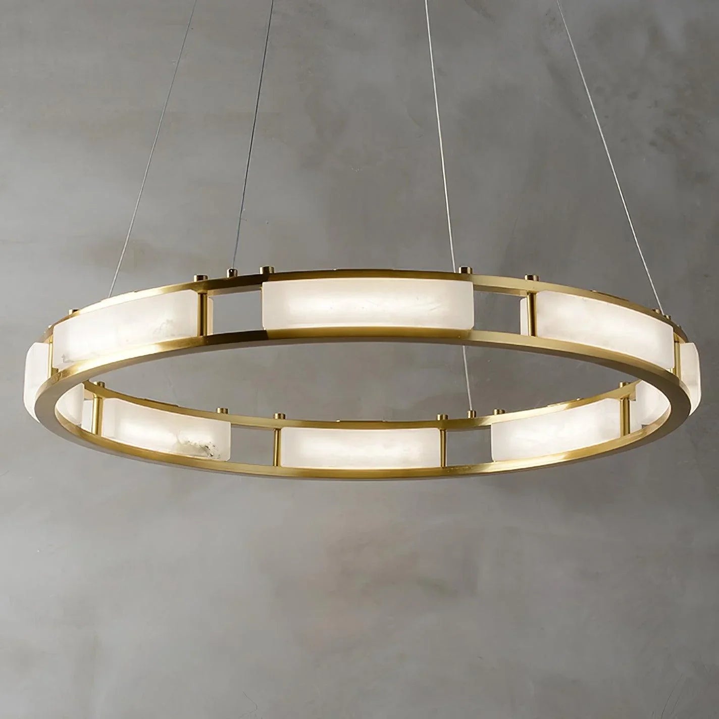 Modern circular pendant chandelier with brass frame and white alabaster panels hanging on wires