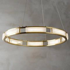 Modern circular pendant chandelier with brass frame and white alabaster panels hanging on wires