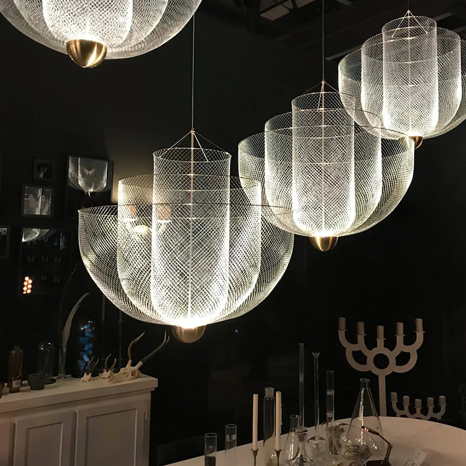 Modern YH Lamps pendant lamp chandelier with gold base and mesh shade hanging over dining table