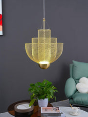 Modern gold mesh pendant chandelier lamp hanging in stylish living room with green sofa and coffee table