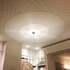 Modern YH Lamps pendant lamp with chrome body and gold base casting intricate warm light mesh shadows on ceiling