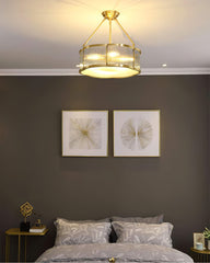 Modern brass and glass chandelier pendant lamp above stylish bedroom decor, YH Lamps