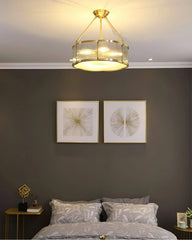Modern brass and glass chandelier pendant lamp above stylish bedroom decor, YH Lamps
