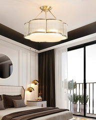 Modern brass pendant chandelier by YH Lamps in elegant bedroom interior with natural light.