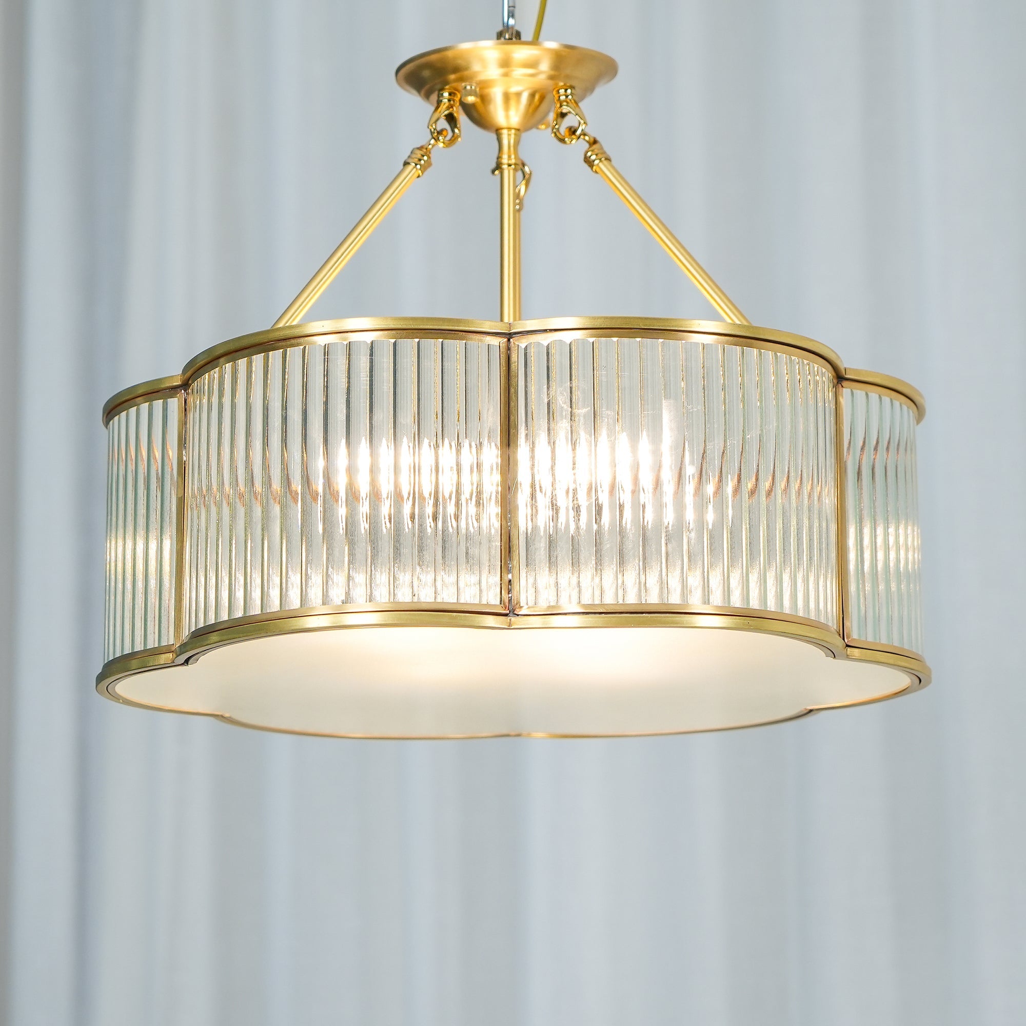 Modern brass pendant chandelier with ribbed glass shade from YH Lamps, elegant lighting design