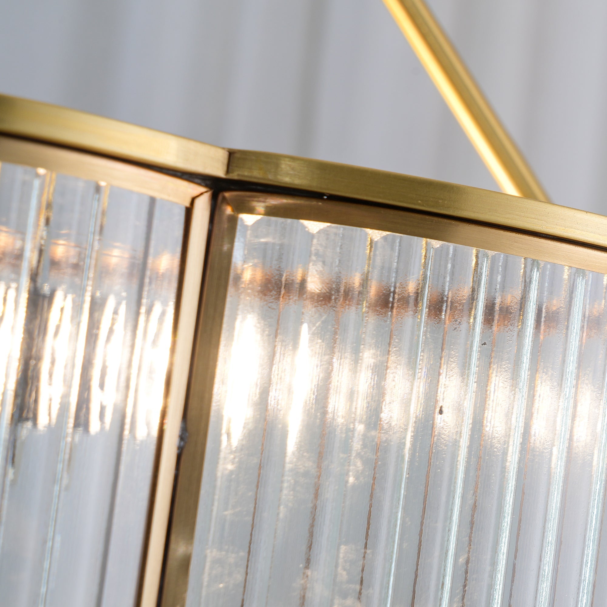 Close-up of modern brass and glass pendant chandelier by YH Lamps