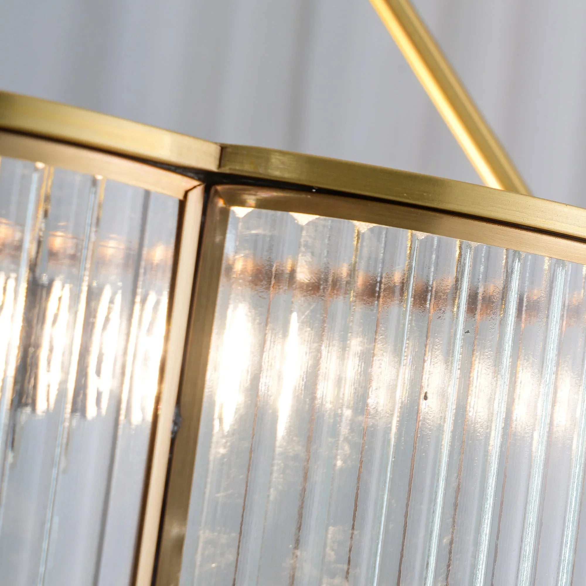 Close-up of modern brass and glass pendant chandelier by YH Lamps