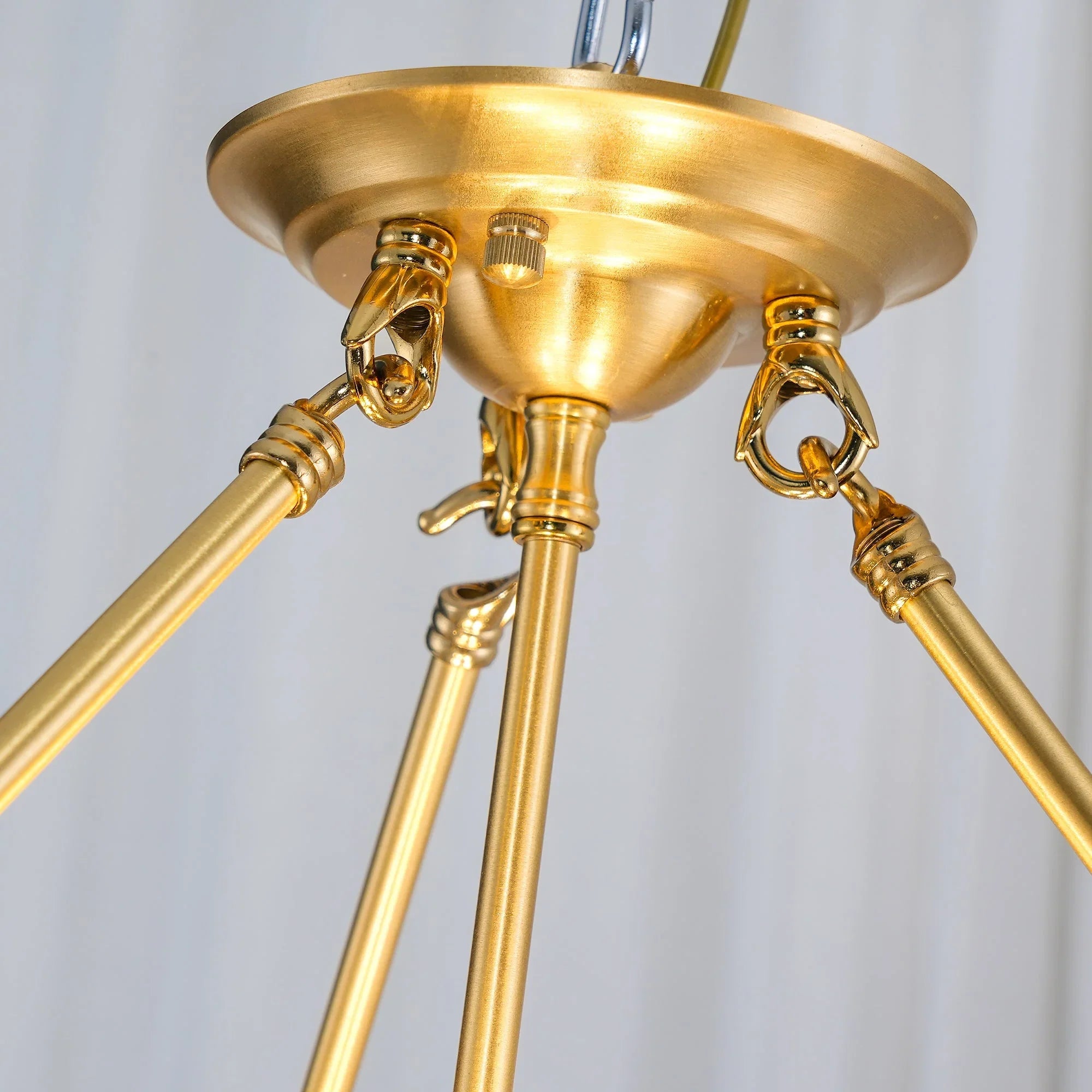 Close-up of modern brass pendant chandelier with gold rods from YH Lamps