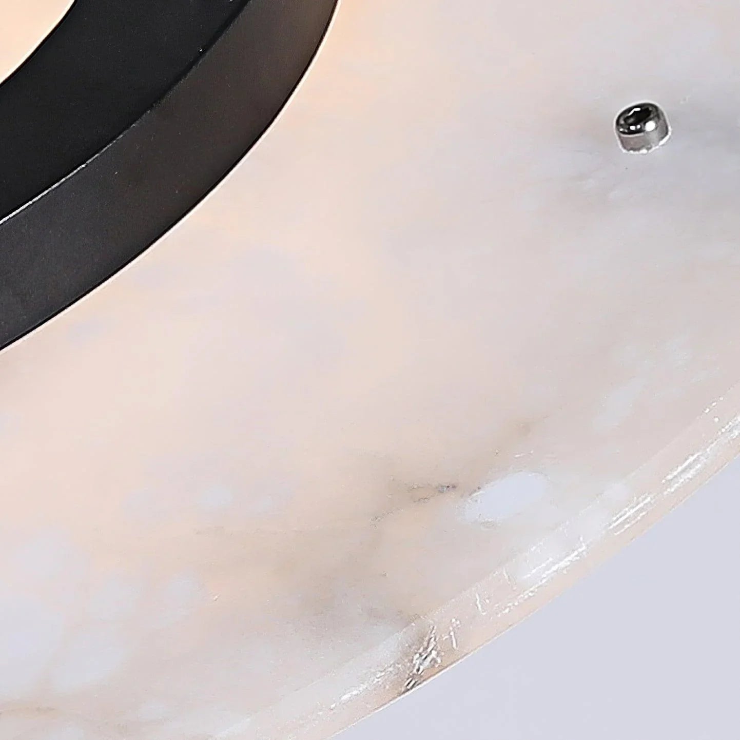 Close-up of modern black and white chandelier pendant lamp with smooth, curved design