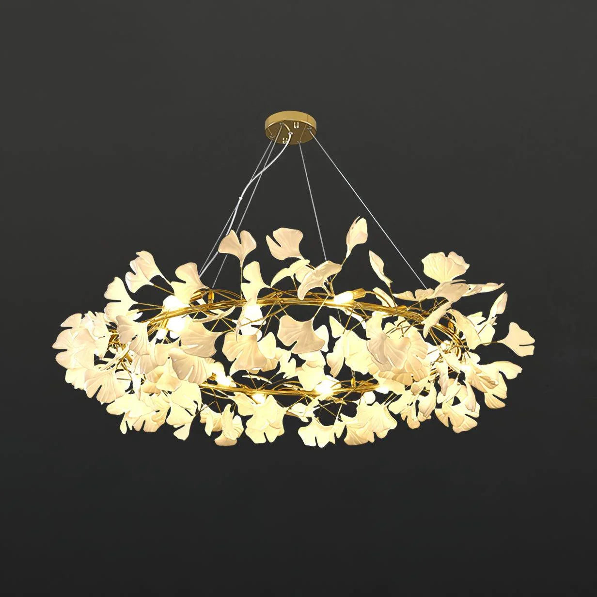 Modern gold and white gingko leaf chandelier pendant lamp with warm light, suspended by cables