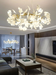 Modern living room with gold and white gingko leaf chandelier pendant lamps, elegant home lighting