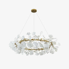 Modern gold pendant chandelier with white gingko leaf design hanging from ceiling