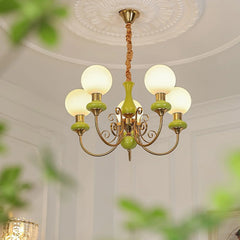 YH Lamps modern chandelier with 5 white globe lights and green gold accents hanging in classic ceiling