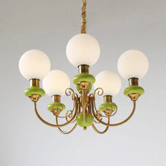 Modern chandelier with five white globe lights and gold-green metal frame by YH Lamps