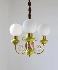 Modern 3-head chandelier pendant lamp with white glass globes, gold metal arms, and green accents