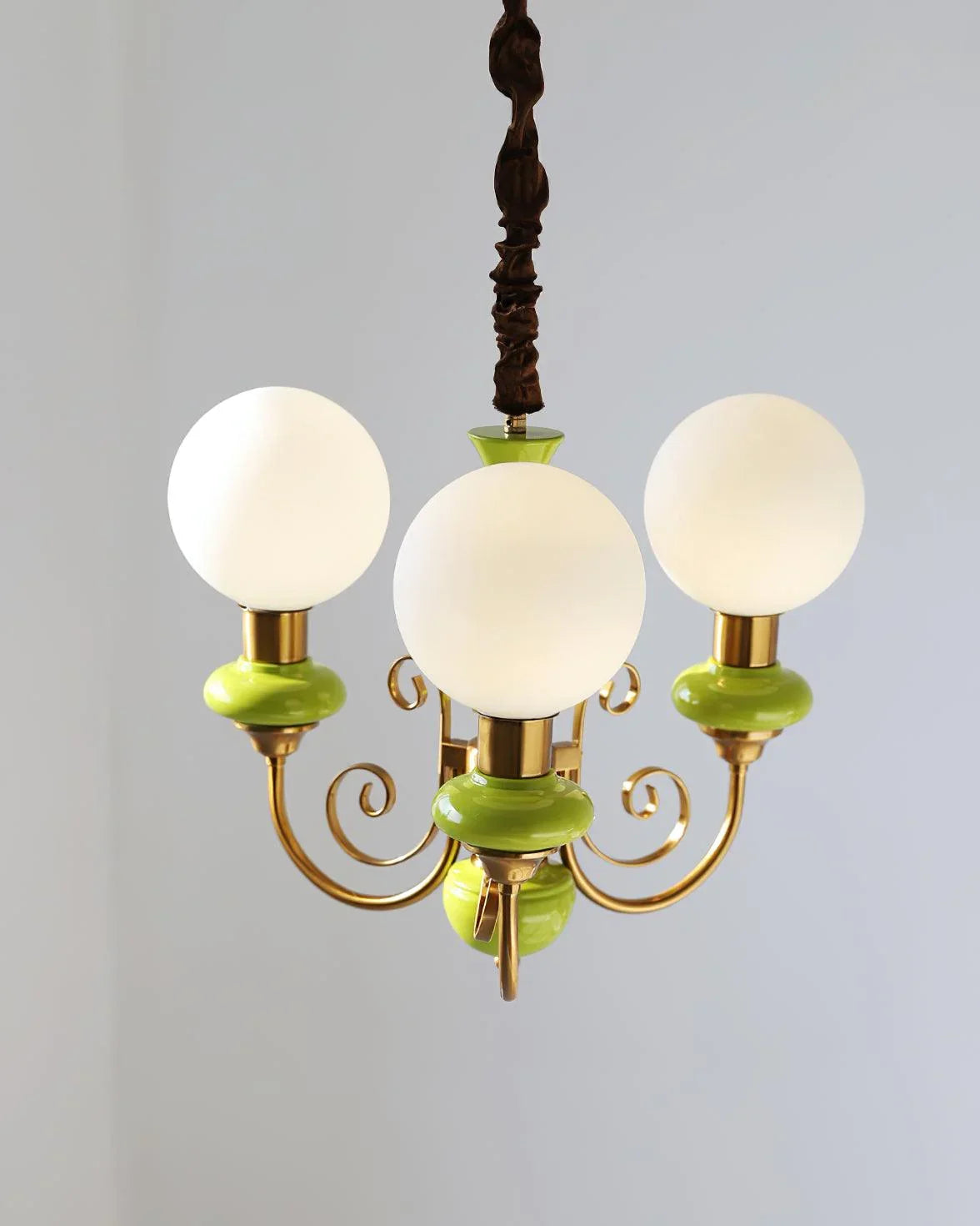 Modern 3-head chandelier pendant lamp with white glass globes, gold frame, and green accents, elegant home lighting