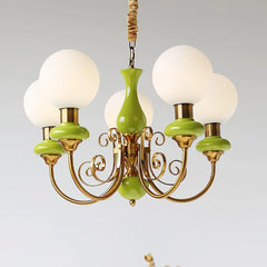 Modern chandelier with five white globe lampshades and green gold metal arms, elegant pendant light