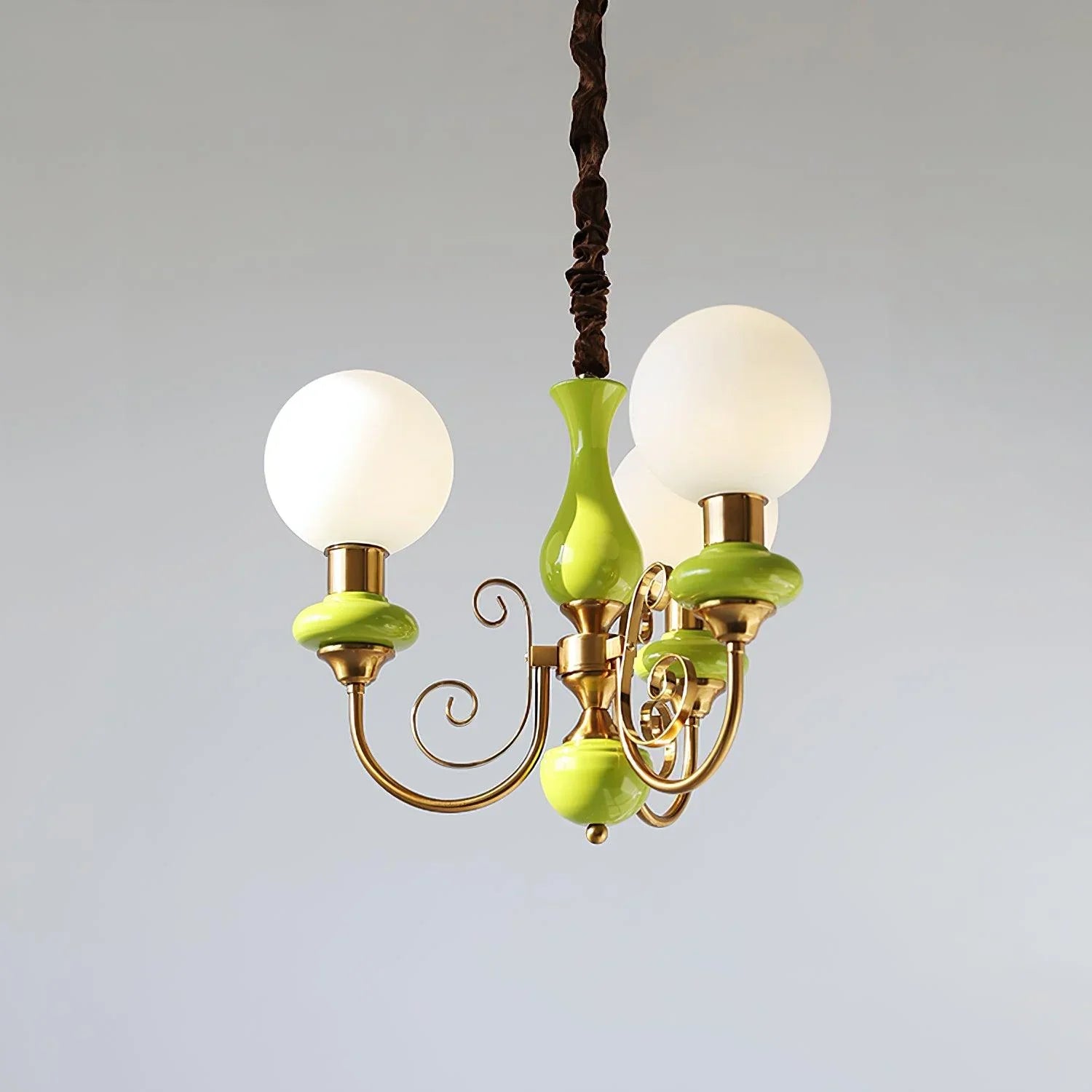 Modern chandelier with three white globe lights on gold and lime green metal arms, hanging lamp from YH Lamps