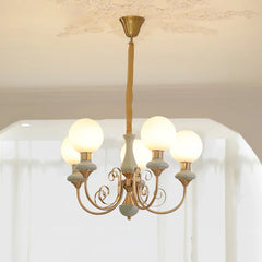 Modern gold and white chandelier pendant lamp with five glowing round bulbs and ornate curved arms