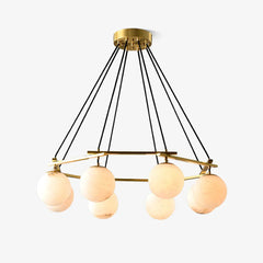 Modern chandelier with eight alabaster globe lights and brass frame hanging from ceiling mount