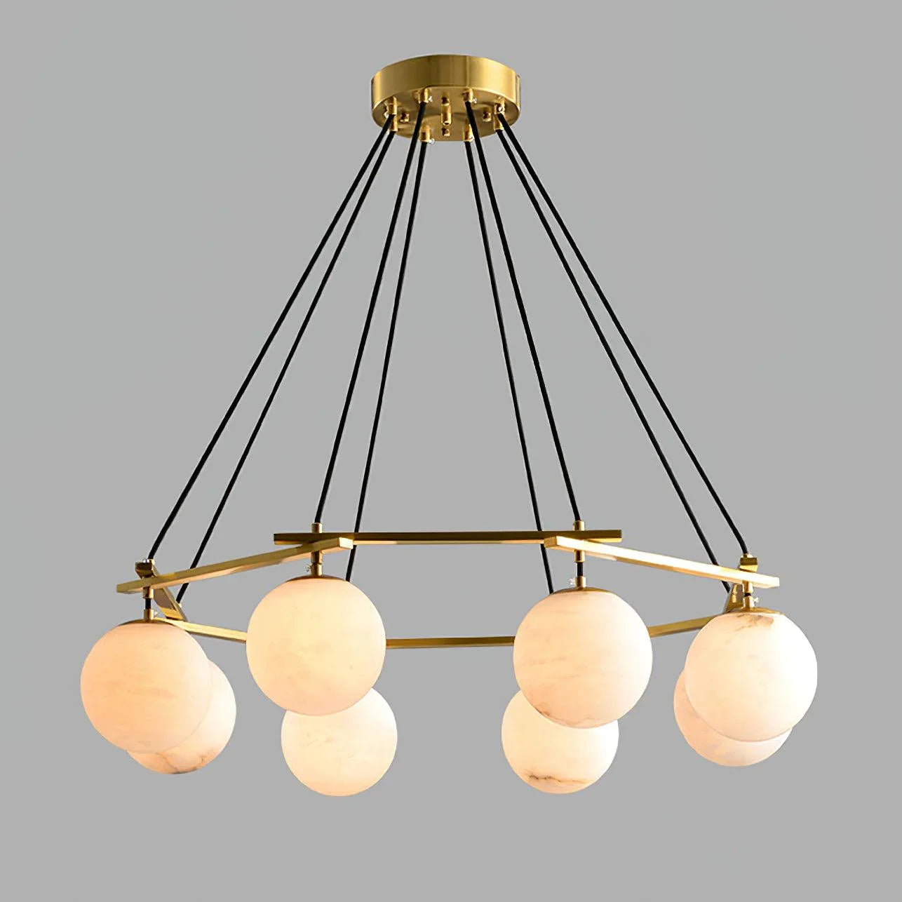 Modern chandelier with eight alabaster globe lights suspended from brass frame by black cords