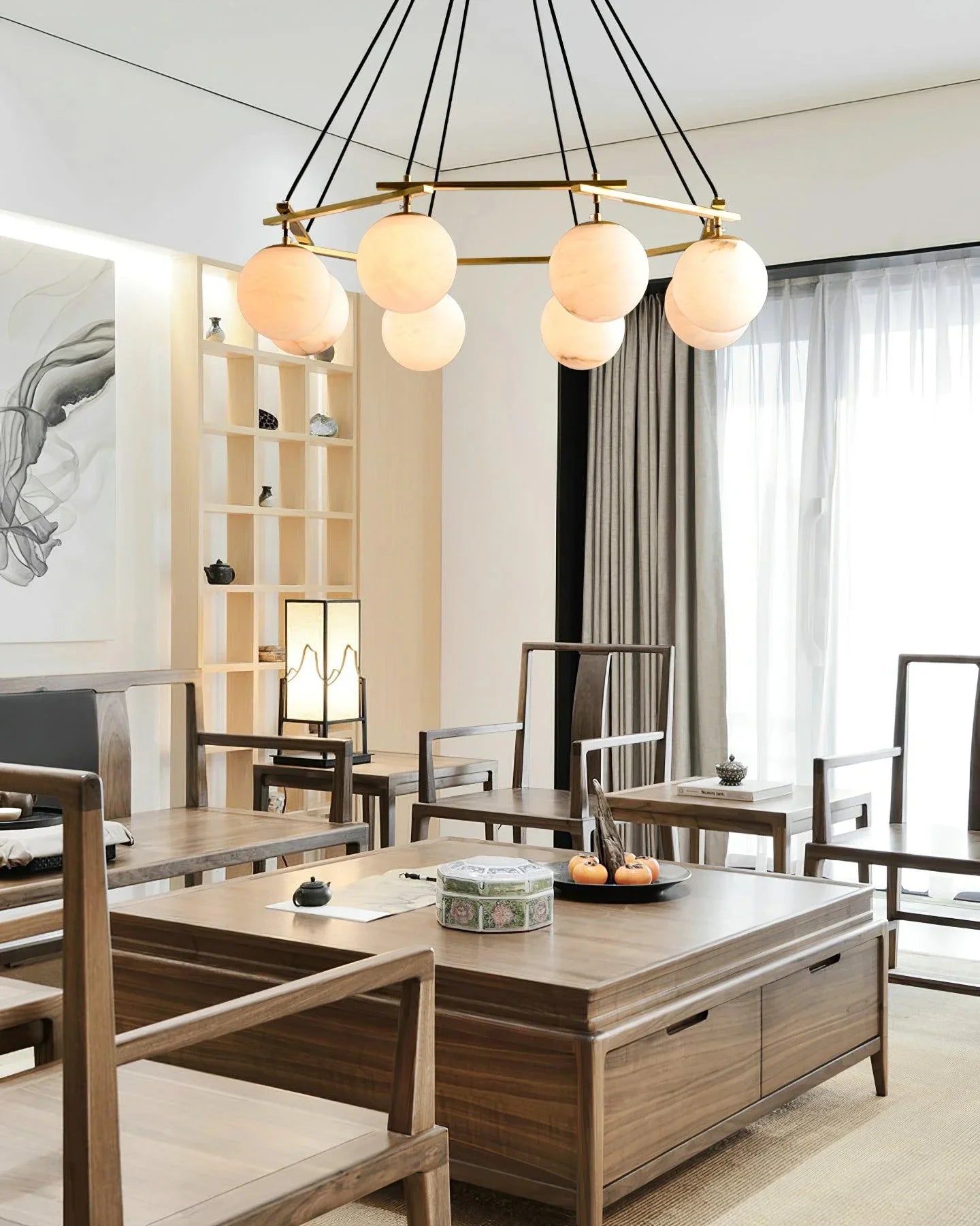 Modern dining room with brass white alabaster chandelier featuring eight round lights above wooden furniture